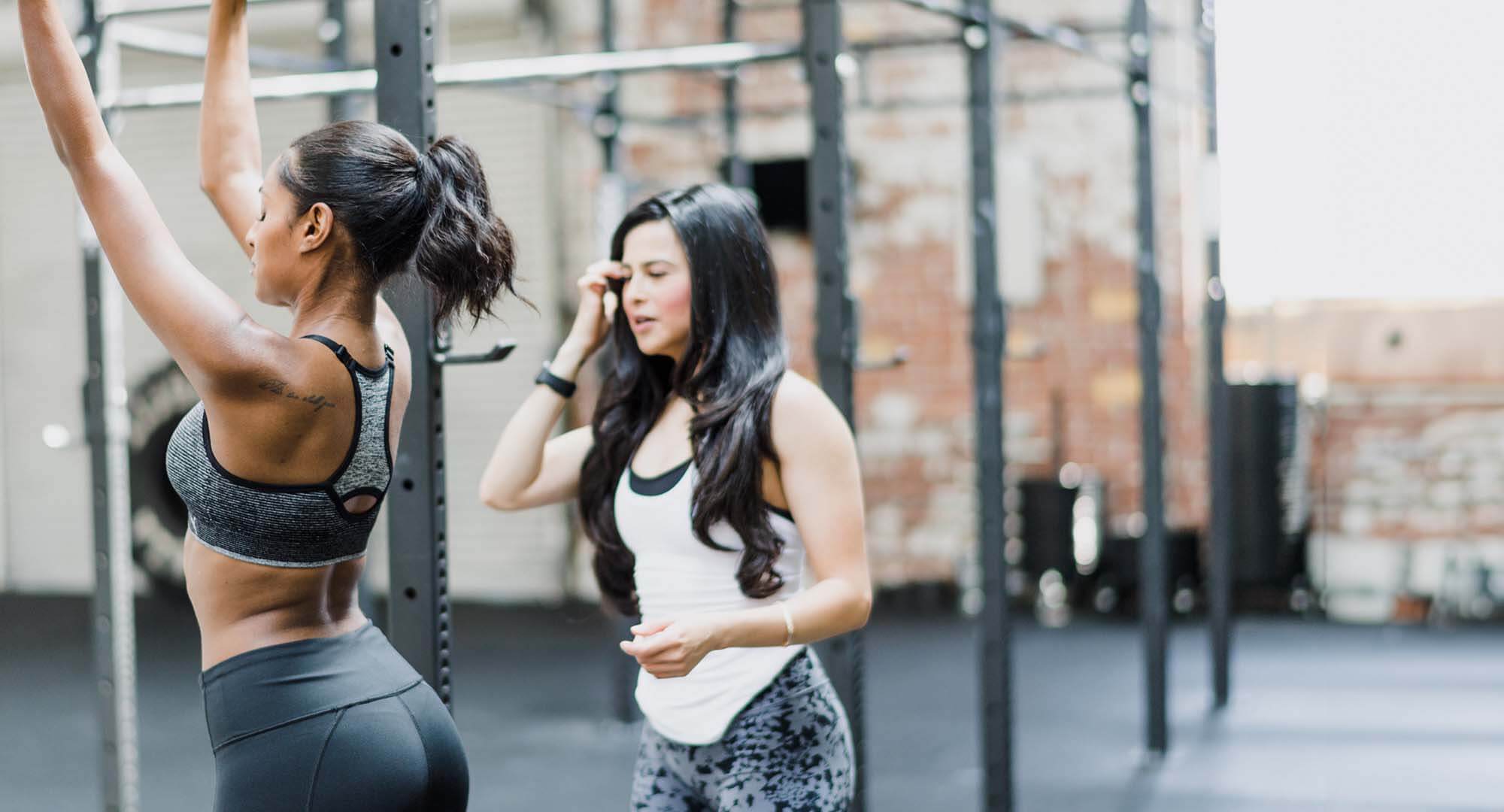 Fitness studio Two women talking in a fitness studio