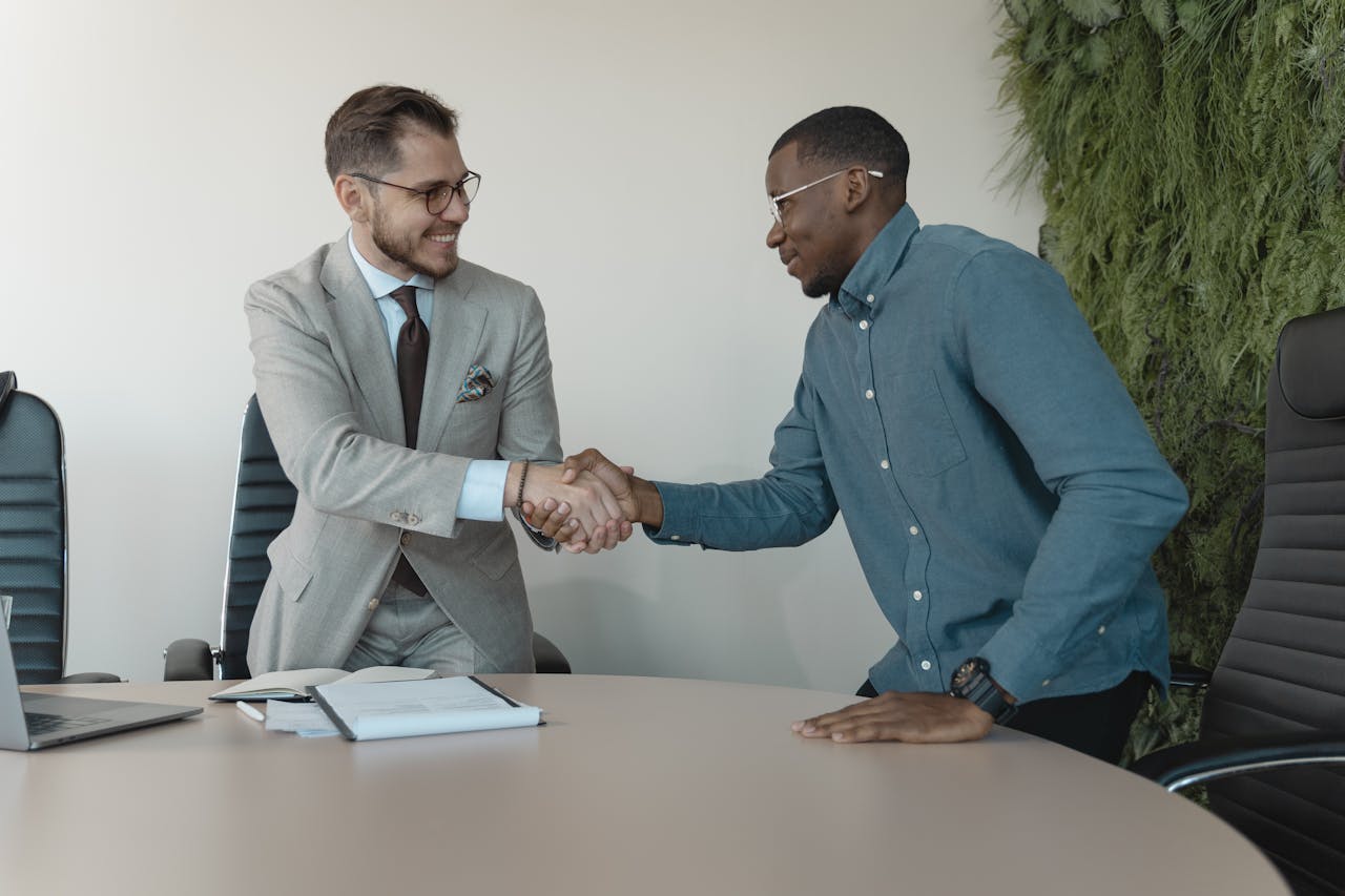 Closing a deal Two professionals shaking hands after a meeting