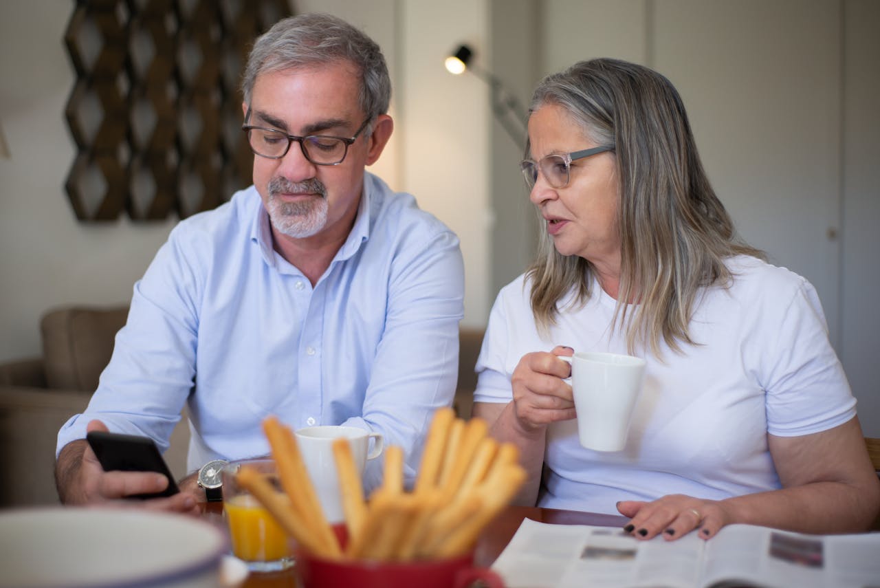 Couple reviewing rental income and expenses at home