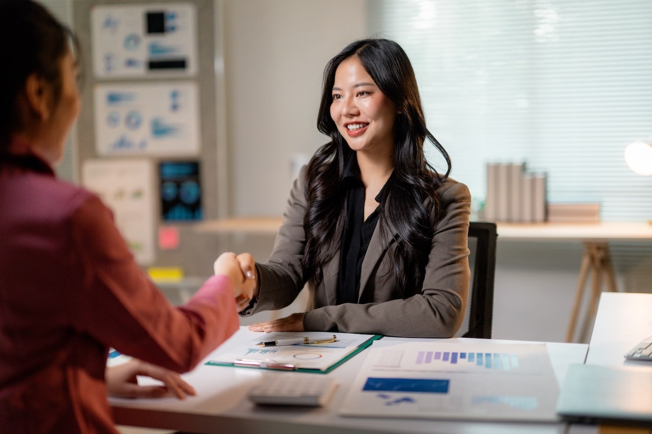 Accountant greeting a client with a handshake