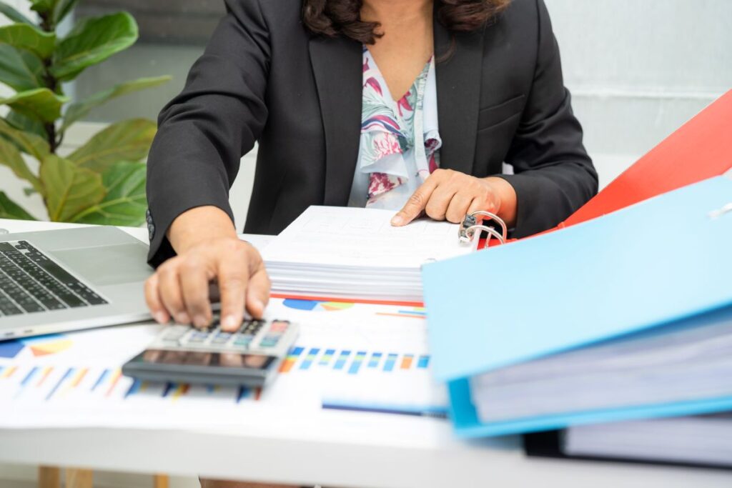 Tax accountant negotiating with CRA officer on behalf of a small business owner.