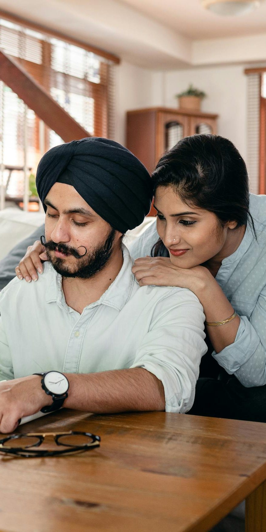 Couple at home going over their finances together