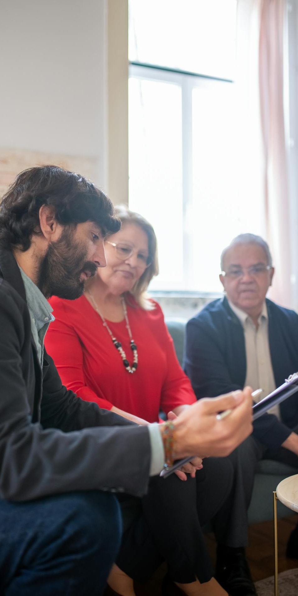 Advisor meeting with an older couple to go over their documents